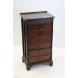 Oak chest, of small proportions, fitted with eight drawers & brackets