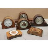 A collection of six vintage wooden cased mantle clocks.