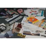 A small collection of stamps, first day covers and postcards.