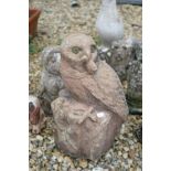 A collection of outdoor garden ornaments to include an owl, duck, bird of prey ..etc.