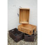A collection of four vintage wooden crates to include two Ushers examples.