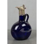 A Bristol blue glass claret jug with silver plated lid and collar.