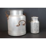 Vintage alloy dairy churn, together with one other