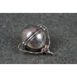A fully hallmarked sterling silver metamorphic ball pendant.