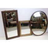 Two ornate antique framed gilt mirrors, together with a large bevelled edge mirror (3)