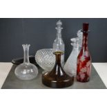 A collection of vintage glass decanters together with two glass bowls.