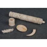 A small collection of antique Ivory to include needle case, brooches and a pendant.