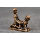 Metal figure of an erotic couple