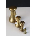 A group of four vintage Avery brass weights to include 2oz, 1lb, 2lb and 7lb.