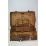 A vintage leather fitted suitcase, stamped B.A.S.W. to the outer lid.