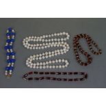A small quantity of costume jewellery necklaces to include freshwater pearls and garnets.