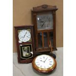 A vintage oak cased wall clock.