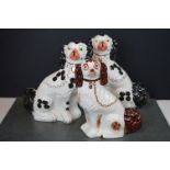 Pair of Arthur Wood Staffordshire Wally Dogs, together with another Staffordshire flat back dog