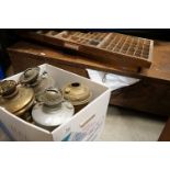 A group of mixed collectables to include printers trays, vintage oil lamps and a large wooden box.