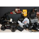 A large collection of vintage cameras and photographic equipment to include Cameras, Lenses,