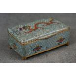 A vintage Chinese cloisonné trinket box with dragon decoration.