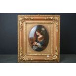Berlin style Oval Porcelain Plaque decorated with a lady playing the piano, 17cms high, with a