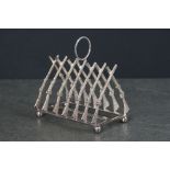 Silver plated toast rack in the form of rifles