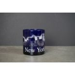 An American made New York blue glass mug decorated with the New York skyline including the Twin