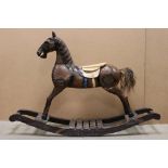 Wooden Rocking Horse raised on a bow rocker, 124cms long x 85cms high