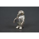 Solid heavy silver figure of a penguin, with glass eyes