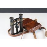 Pair of early 20th century binoculars in a leather case