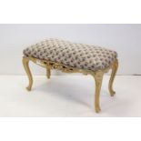 Continental Dressing Stool in the Rococo manner with upholstered seat on a cream painted base, 90cms