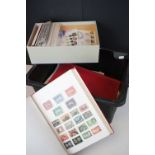 A large collection of British and world stamps contained within albums together with a quantity of