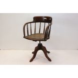 Late 19th / Early 20th century Oak Swivel Office Tub Chair with turned spindle back