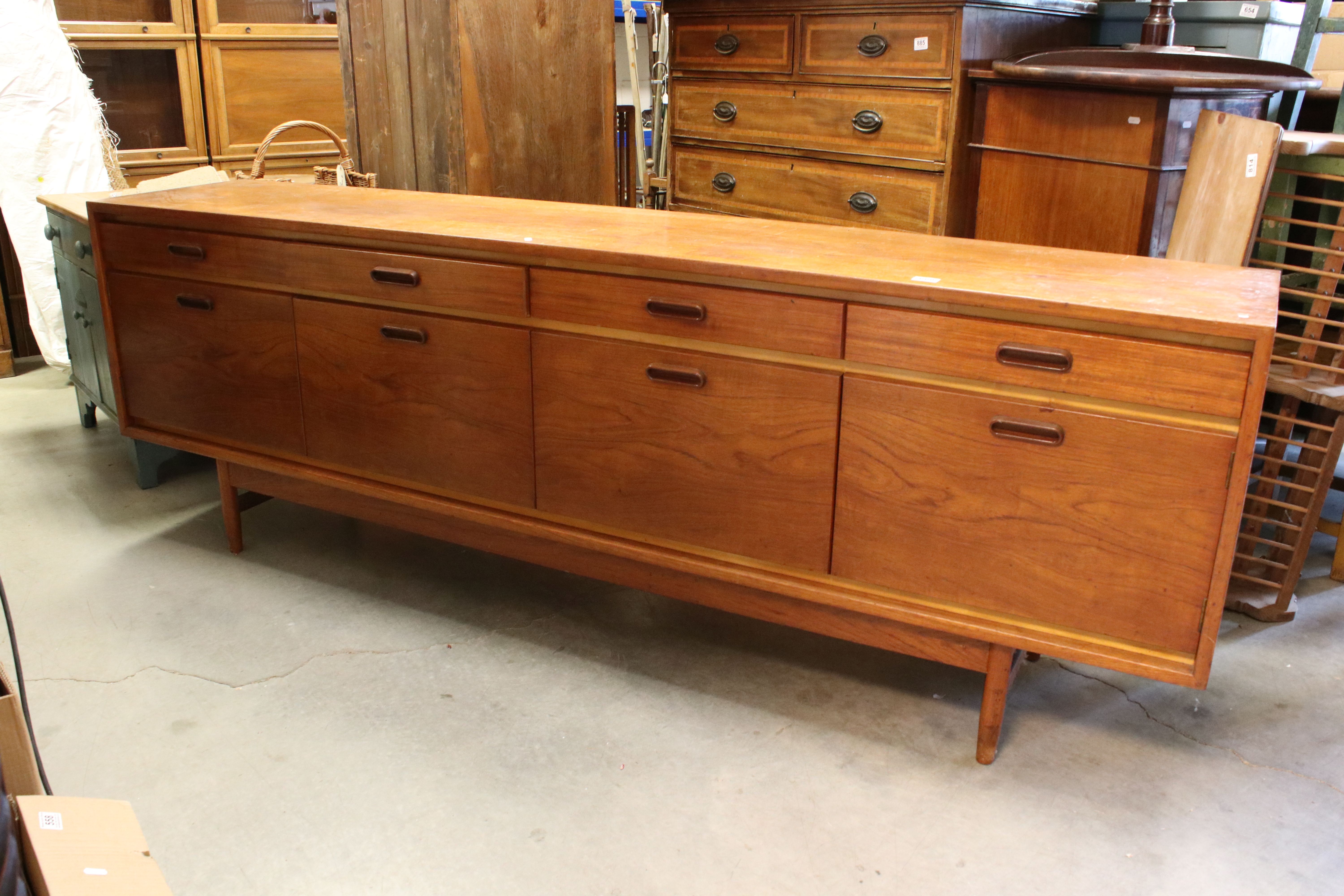 Mid century Retro ' White & Newton ' Teak Sideboard with four drawers over two cupboard doors and