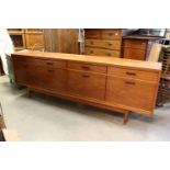 Mid century Retro ' White & Newton ' Teak Sideboard with four drawers over two cupboard doors and