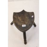 Oak Stool with Shield Shaped Seat and raised on three turned legs, 29cms wide x 31cms high