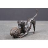 Bronze figure of a dog and a hedgehog