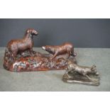 Two dog sculptures, to include a sheepdog with a sheep & a terrier