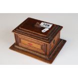 A vintage wooden tramp art card box with suit markers to sides..