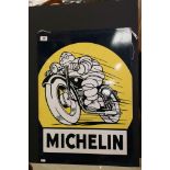 A reproduction Michelin motorcycle tyre's enamel sign.