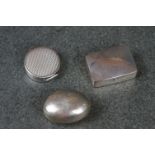 A collection of three hallmarked sterling silver pill boxes.