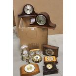 A collection of vintage clocks and barometers to include anniversary and mantle examples.