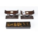 Japanese Black Lacquered Papier Mache Pen Box, the lid with gilt decoration of figures, 20cms long