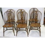 Set of six hoop backed wheel dining chairs with crinoline stretchers