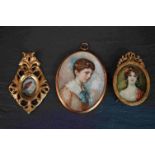 Two vintage framed miniature portraits together with a miniature painting of a bird in gilt frame.