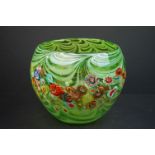 A large Italian green glass vase with floral decoration.