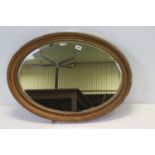 Two ornate gilt oval mirrors & another Art Deco style example (3)