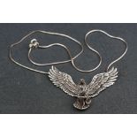 Large silver pendant necklace in the form of an eagle with articulated wings & a serpent