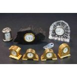 A collection of seven miniature quartz .clocks