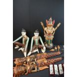 Three South East Asian Painted Carved Wooden Figures, tallest 53cms high together with a Pair of