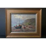 Gilt framed oil on board, coastal scene with fisherfolk, beached boat & cliffs beyond