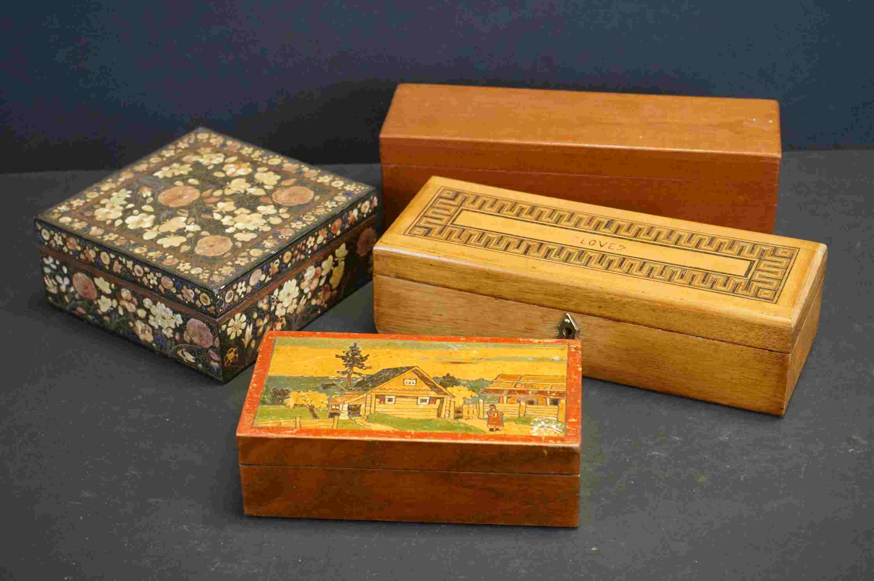 A collection of four boxes to include an Edwardian Tunbridge inlaid glove box, a dominoes box and