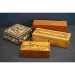 A collection of four boxes to include an Edwardian Tunbridge inlaid glove box, a dominoes box and