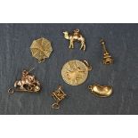 A collection of seven hallmarked 9ct gold charms to include St. George & the Dragon, spiders web and